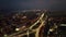 Aerial view of city at night. Street traffic of the city. Urban Landscape.