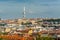Aerial view of citycape of old town of Prague, with a lot of  rooftops, churches, and the landmark of Television Tower. view from