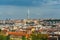 Aerial view of citycape of old town of Prague, with a lot of  rooftops, churches, and the landmark of Television Tower. view from