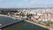 Aerial view of a cityscape with the Branko bridge over a river between buildings