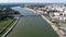 Aerial view of a cityscape with the Branko bridge over a river between buildings