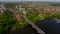 Aerial view of the cityscape with a buildings, river and bridge.