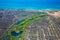 Aerial view of the cityscape of Honolulu district near the airport with private houses