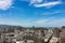 Aerial view of the cityscape of Kaohsiung in Taiwan with tall buildings and blue sky on a sunny day