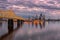 Aerial view of cityscape Louisville surrounded by buildings and water during sunset