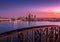 Aerial view of cityscape Louisville surrounded by buildings and water during sunset