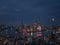 Aerial view of cityscape Shanghai surrounded by buildings and water in evening