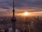 Aerial view of cityscape Shanghai surrounded by buildings and water during sunset