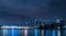 Aerial view of cityscape Vancouver surrounded by buildings and water in night