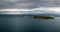 Aerial view of the Clare Island lighthouse on one of the sunken drumlin islands in Clew Bay in County Mayo of western Ireland