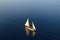 aerial view of a classic sailboat gliding on calm sea