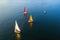 aerial view of classic sailboats racing on open water
