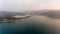 Aerial view of cliffs raising above sea.