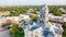 Aerial view close-up Clock Tower of Hood County Courthouse and lush green neighborhood in Granbury, Texas, USA