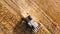 Aerial view, close up details of farmer using combine to harvest crops