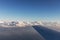 Aerial view of clouds lit by the evening sun over Florida, view from the aircraft during the flight.