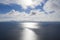 Aerial view clouds over the sea. View seashore and coastline from drone. Aerial top view cloudscape. Texture of clouds. View from