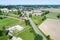 Aerial view of the clubhouse of a regional football club on the outskirts of the city next to a big street, football field in the