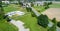 Aerial view of the clubhouse of a regional football club on the outskirts of the city next to a big street, football field in the