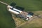 An aerial view of a cluster of agricultural storage buildings.