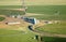 An aerial view of a cluster of agricultural storage buildings.