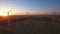 Aerial view of cluster of wind turbines in rural agriculture field