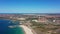 Aerial view of a coal-fired power plant in the city of Sines, overlooking sea in Portugal. Water channels for