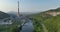 Aerial view of coal power plant high pipes with black smoke moving up polluting atmosphere at sunset