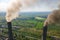 Aerial view of coal power plant high pipes with black smokestack polluting atmosphere. Electricity production with