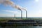 Aerial view of coal power plant high pipes with black smokestack polluting atmosphere. Electricity production with