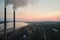 Aerial view of coal power plant high pipes with black smokestack polluting atmosphere. Electricity production with