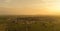 Aerial view of coal power plant - Sunrise near green agriculture field with factories outside the city, Raichur, India