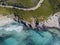 Aerial view of the coast of Corsica, winding roads and coves with crystalline sea. France