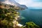 Aerial view on the coast, lake with waves and village of Santa Cruz at Lago de Atitlan, Guatemala