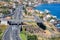 Aerial view at coast Madeira with Highway along Santa Cruz