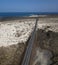 Aerial view of the coastal road that crosses the beaches and coves of MojÃ³n Blanco and Spiral Caleta. Lanzarote, Canary Islands,