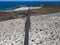 Aerial view of the coastal road that crosses the beaches and coves of MojÃ³n Blanco and Spiral Caleta. Lanzarote, Canary Islands,