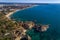 Aerial view of the coastline with beautiful beaches along the city of Portimao in Algarve