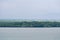 Aerial view of the coastline of mangrove forest and river landscape. Seascape view with sea, palm tree and fishing village. Island