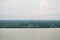 Aerial view of the coastline of mangrove forest and river landscape. Seascape view with sea, palm tree and fishing village. Island