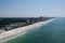 An aerial view of the coastline of Panama City Beach Florida laong the emerald green waters of the Gulf of Mexico