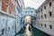 Aerial view of colorful boats sailing along a tranquil canal in Venice, Italy