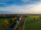 Aerial view of a colorful dramatic sunrise sky over a canal in Belgium. Canals with water for transport, agriculture