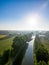 Aerial view of a colorful dramatic sunrise sky over a canal in Belgium. Canals with water for transport, agriculture