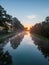 Aerial view of a colorful dramatic sunrise sky over a canal in Belgium. Canals with water for transport, agriculture