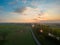 Aerial view of a colorful dramatic sunrise sky over a canal in Belgium. Canals with water for transport, agriculture