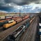 Aerial view Colorful freight trains on station, bustling industrial landscape