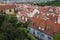 Aerial view of the colorful orange roofs of old houses in the city of Europe Prague