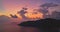 aerial view colorful pink Light through the clouds above the island.