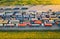 Aerial view of colorful trucks in terminal at sunset in summer